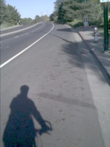 [Shadow of Corey on his bike]